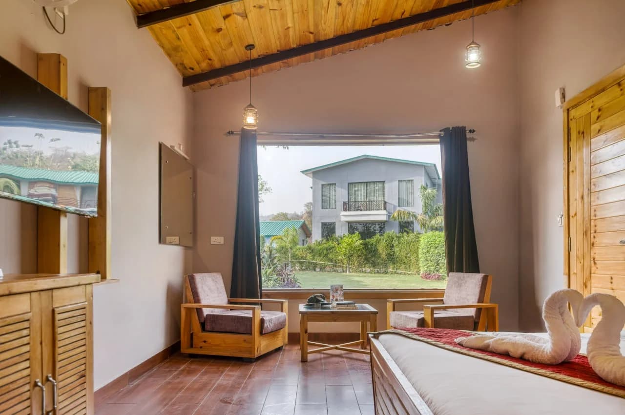 Deluxe Resort Room Interior with Wooden Ceiling and Scenic View